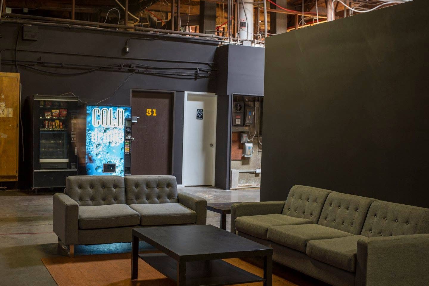 Lounge couches beside the snack and cold drink machines