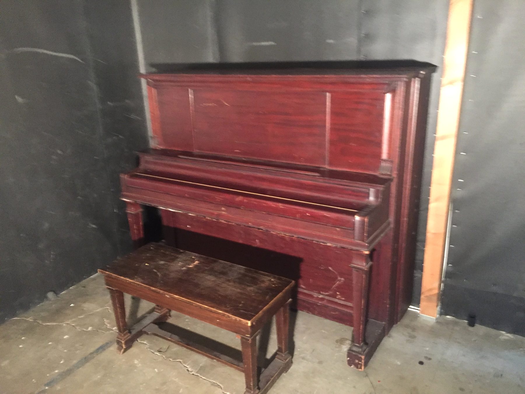 The vintage Conover upright piano and bench